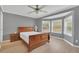 Main bedroom with hardwood floors, bay window, and ceiling fan at 37620 Howard Ave, Dade City, FL 33525