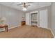 Bedroom with ceiling fan, hardwood floors, and ample closet space at 37620 Howard Ave, Dade City, FL 33525