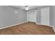 Simple bedroom with wood floors and a closet at 37620 Howard Ave, Dade City, FL 33525