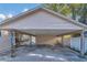 Covered carport with concrete flooring at 37620 Howard Ave, Dade City, FL 33525