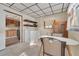 Laundry Room with view into kitchen and extra shelving at 37620 Howard Ave, Dade City, FL 33525