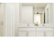 Double vanity bathroom with a shower and modern finishes at 3945 Northern Key Dr, Plant City, FL 33563