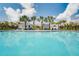 Community pool with cabanas and seating at 3945 Northern Key Dr, Plant City, FL 33563