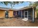 The property boasts a screened porch and a large backyard with beautiful landscaping at 4020 Concord Way, Plant City, FL 33566