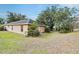 View of the home's back, showcasing a sizable backyard with ample space at 4020 Concord Way, Plant City, FL 33566