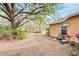 Backyard view of the house, showcasing a grill and surrounding landscape at 4020 Concord Way, Plant City, FL 33566