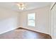 Bedroom with wood-look tile floors and a large closet at 4020 Concord Way, Plant City, FL 33566