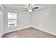 Bright bedroom with ceiling fan and tile flooring at 4020 Concord Way, Plant City, FL 33566