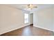 Simple bedroom with dark wood-look tile floors at 4020 Concord Way, Plant City, FL 33566