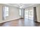 Spacious bedroom with dark tile floors and sliding door to patio at 4020 Concord Way, Plant City, FL 33566