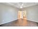 Main bedroom with tile floors and ensuite bathroom at 4020 Concord Way, Plant City, FL 33566