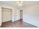Bedroom with wood-look tile floors and a large closet at 4020 Concord Way, Plant City, FL 33566