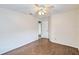 Well-lit bedroom with dark wood-look tile floors at 4020 Concord Way, Plant City, FL 33566
