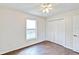 Bedroom with wood-look tile floors and a large closet at 4020 Concord Way, Plant City, FL 33566