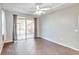 Spacious bedroom with dark tile floors and sliding door to patio at 4020 Concord Way, Plant City, FL 33566