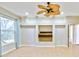 Bright Gathering room with tile floors, built-in shelving, and large window at 4020 Concord Way, Plant City, FL 33566