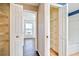 Home hallway with built-in shelving and access to bedroom and bathroom at 4020 Concord Way, Plant City, FL 33566