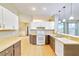 Kitchen with two-toned cabinets, tile floor and island at 4020 Concord Way, Plant City, FL 33566