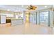 Kitchen with island, view of living room and sliding doors at 4020 Concord Way, Plant City, FL 33566