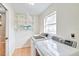 Laundry room with washer, dryer, and shelving at 4020 Concord Way, Plant City, FL 33566