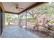 Screened porch with ceiling fan and backyard view at 4020 Concord Way, Plant City, FL 33566
