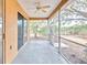 Spacious screened porch with ceiling fan and view of backyard at 4020 Concord Way, Plant City, FL 33566