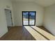 Bright bedroom featuring tile floors and sliding glass doors to backyard at 4066 Irish Ter, North Port, FL 34288