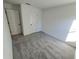 Spacious bedroom with gray carpet and two closets at 4066 Irish Ter, North Port, FL 34288