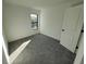 Bright bedroom featuring grey carpet and large window at 4066 Irish Ter, North Port, FL 34288