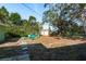 Large backyard with firepit and seating area at 436 Norfolk St, Dunedin, FL 34698