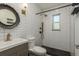 Modern bathroom with white subway tile and a walk-in shower at 436 Norfolk St, Dunedin, FL 34698