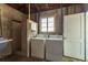 Laundry room with washer, dryer, and exterior access at 436 Norfolk St, Dunedin, FL 34698