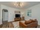 Living room with hardwood floors and mid century modern furniture at 436 Norfolk St, Dunedin, FL 34698