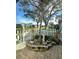 Landscaped front yard with a white picket fence and mature trees at 4498 Lake Blvd, Clearwater, FL 33762