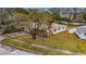 Aerial view of a single Gathering home with large backyard and surrounding trees at 4646 W Longfellow Ave, Tampa, FL 33629