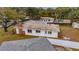 House's rear elevation, showing roofline and backyard at 4646 W Longfellow Ave, Tampa, FL 33629