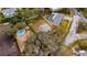 Aerial view of property with pool and surrounding homes at 4646 W Longfellow Ave, Tampa, FL 33629