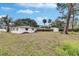 Backyard view of the house, shed, and fence at 4646 W Longfellow Ave, Tampa, FL 33629