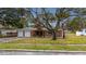 Brick house with two-car garage and mature landscaping at 4646 W Longfellow Ave, Tampa, FL 33629