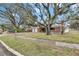 Brick home with two-car garage and landscaping at 4646 W Longfellow Ave, Tampa, FL 33629