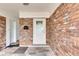 Inviting front entrance with brick facade and white door at 4646 W Longfellow Ave, Tampa, FL 33629