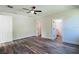 Bright bedroom with wood-look floors and access to a bathroom at 5701 N 20Th St, Tampa, FL 33610