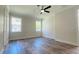 Spacious bedroom with wood-look floors and ceiling fan at 5701 N 20Th St, Tampa, FL 33610