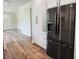 Modern kitchen with stainless steel refrigerator and white cabinets at 5701 N 20Th St, Tampa, FL 33610