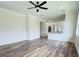 Open living room with hardwood floors and kitchen view at 5701 N 20Th St, Tampa, FL 33610