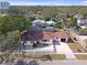 Aerial view of a house with a yard and driveway at 600 30Th N St, St Petersburg, FL 33713