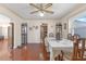 Bright dining room with hardwood floors, large table, and kitchen view at 600 30Th N St, St Petersburg, FL 33713