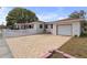 Brick driveway and garage with white exterior at 600 30Th N St, St Petersburg, FL 33713