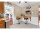 Kitchen with breakfast bar, wood cabinets, and a view to living room at 600 30Th N St, St Petersburg, FL 33713