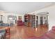 Hardwood floor living room with open concept to dining area at 600 30Th N St, St Petersburg, FL 33713